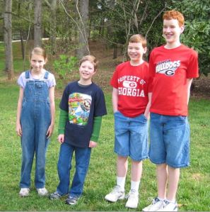 Emma, Nathan, Johnathan McCravy, and Derek McCravy on a homeschool fieldtrip to the William Harris Homestead.